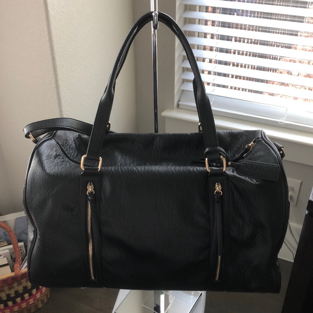 Sole/Society black faux duffel bag w/animal print lining. USED good condition